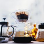 pure black coffee dripping on carafe at the table